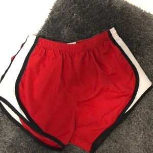 Red running shorts not Nike